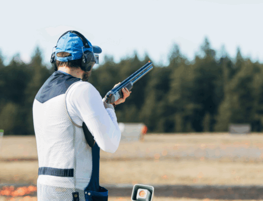 4. Shooter navigating a sporting clays course with varied terrain and target angles.